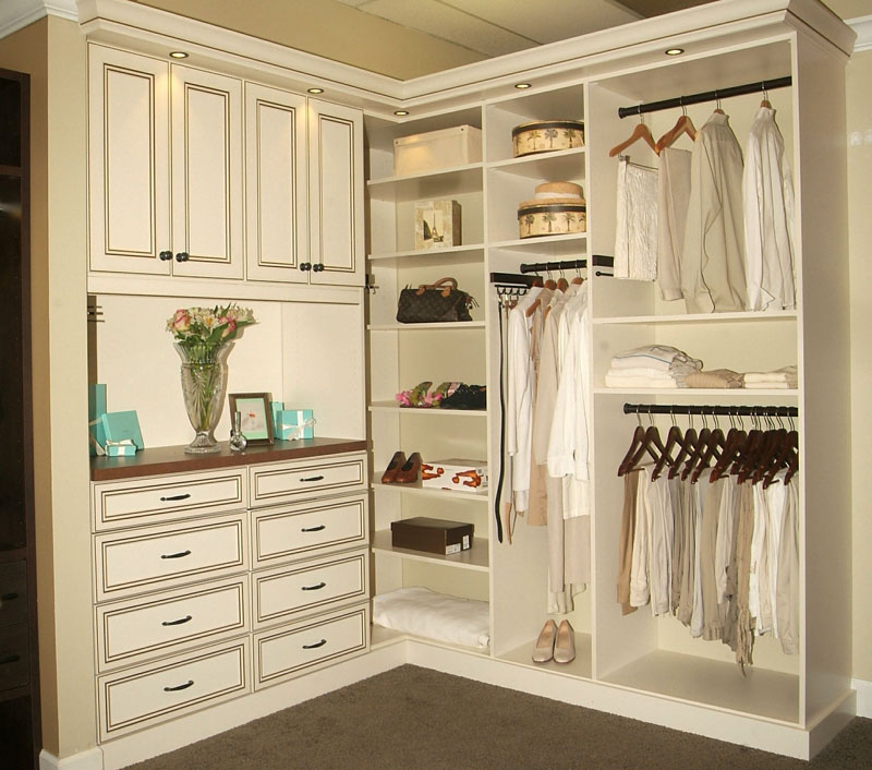 Walk-in closet in glazed antique white fronts and drawer stacks